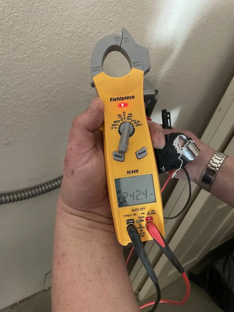 Voltage testing with clamp meter during Electrical Installation Services in Pleasant View